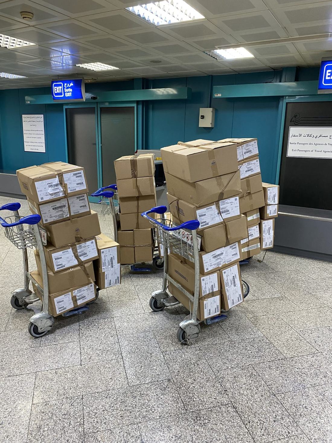Three loaded trolleys at the destination airport in Tunisia