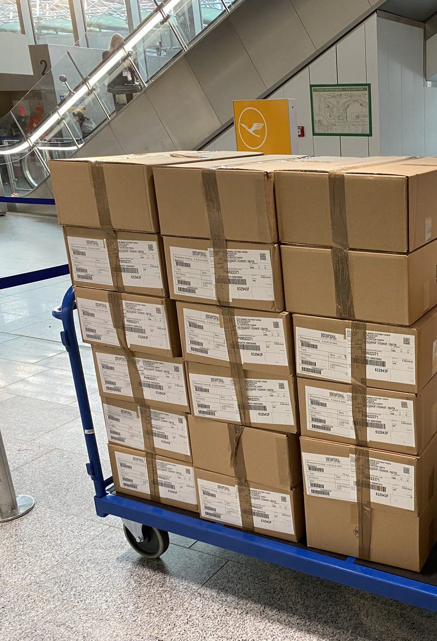 Consolidated parcels stacked on a cart at Frankfurt Airport